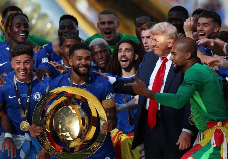 Reece James and his Chelsea teammates celebrate with the trophy alongside US President Donald Trump after winning the FIFA Club World Cup 